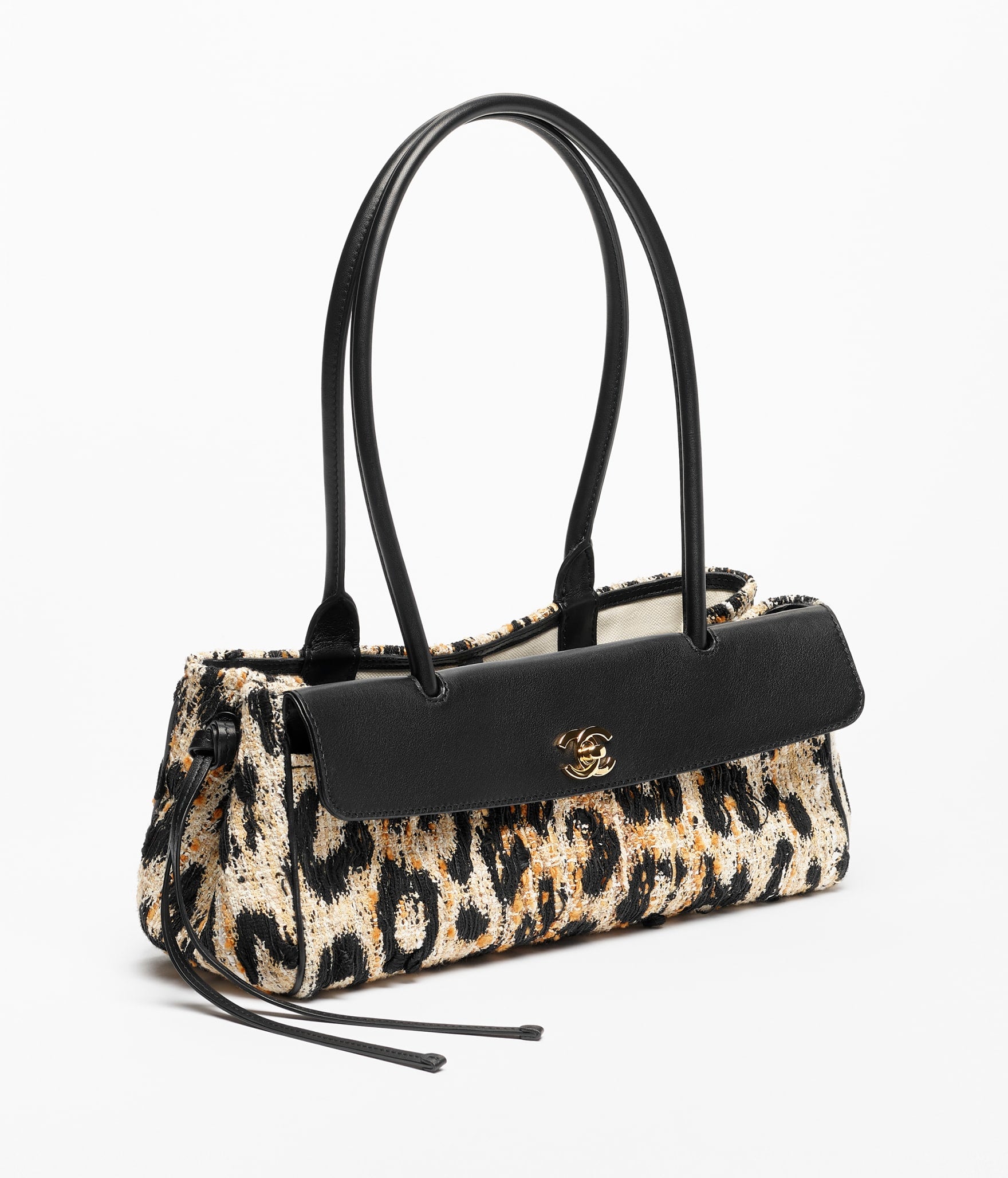 Chanel 25 Bowling Bag

Tweed con estampado animal