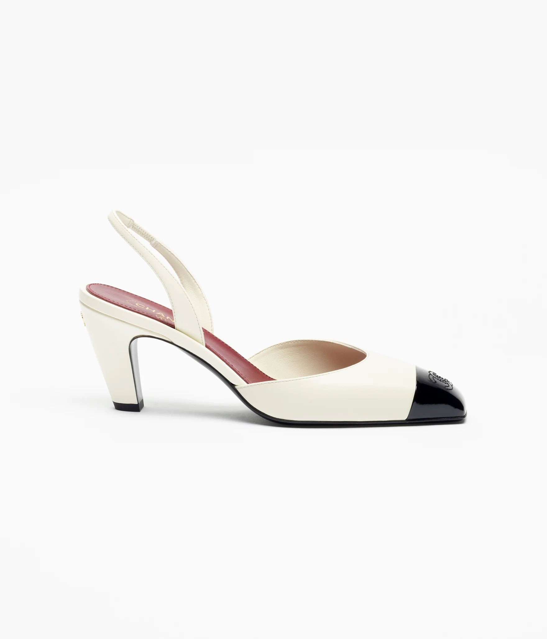 CHANEL CC Slingback Pumps

Color: White/Black