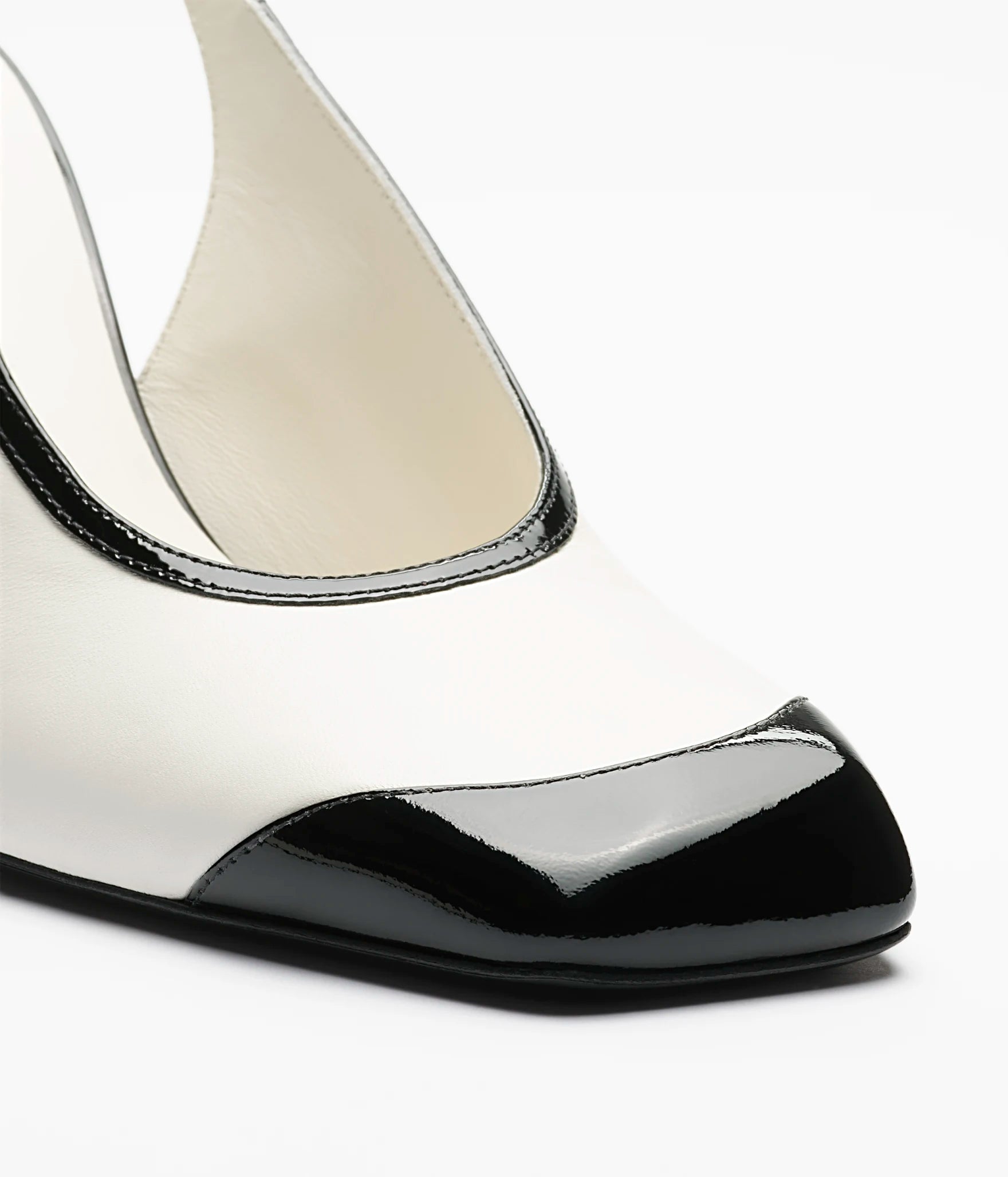 CHANEL Slingback Pumps

Color: White/Black