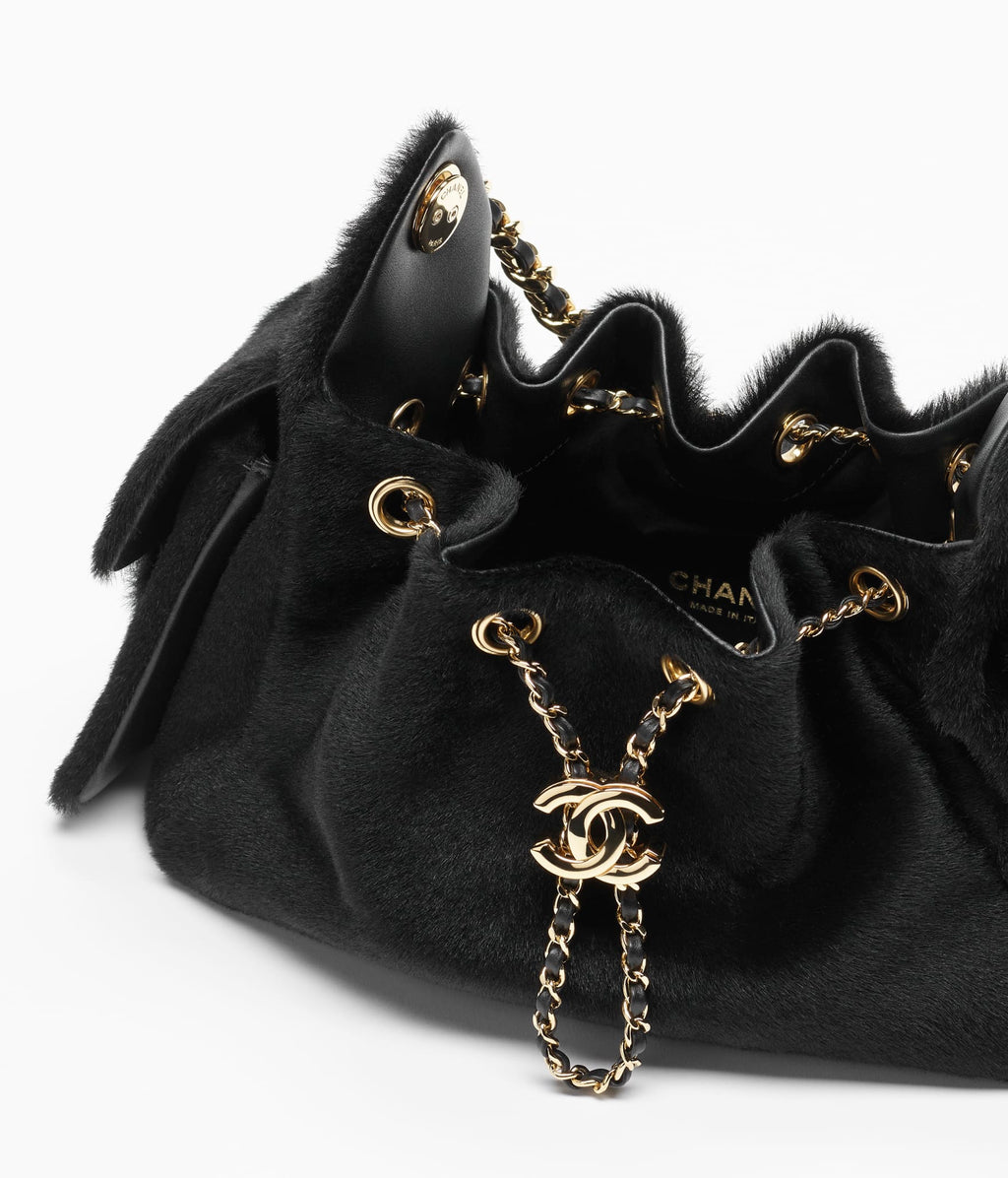 Chanel 25 Mini Bag

Piel de becerro