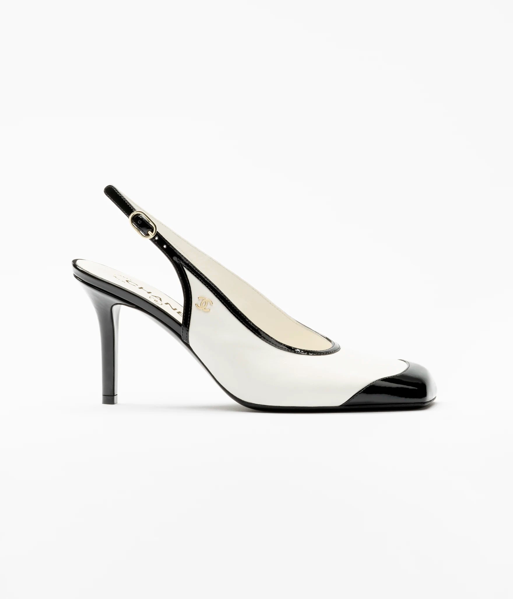 CHANEL Slingback Pumps

Color: White/Black