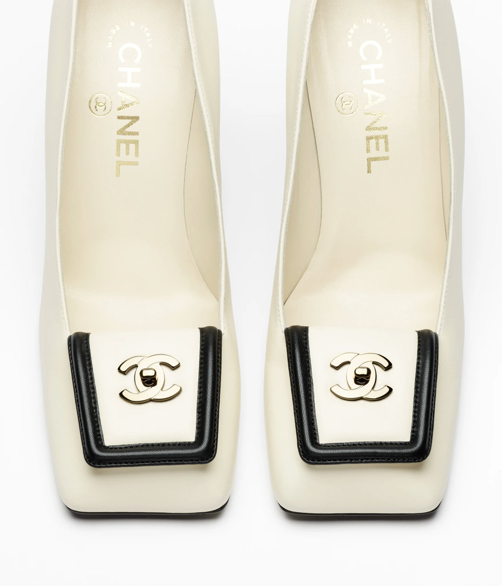 CHANEL Buckle Pumps

Color: White/Black