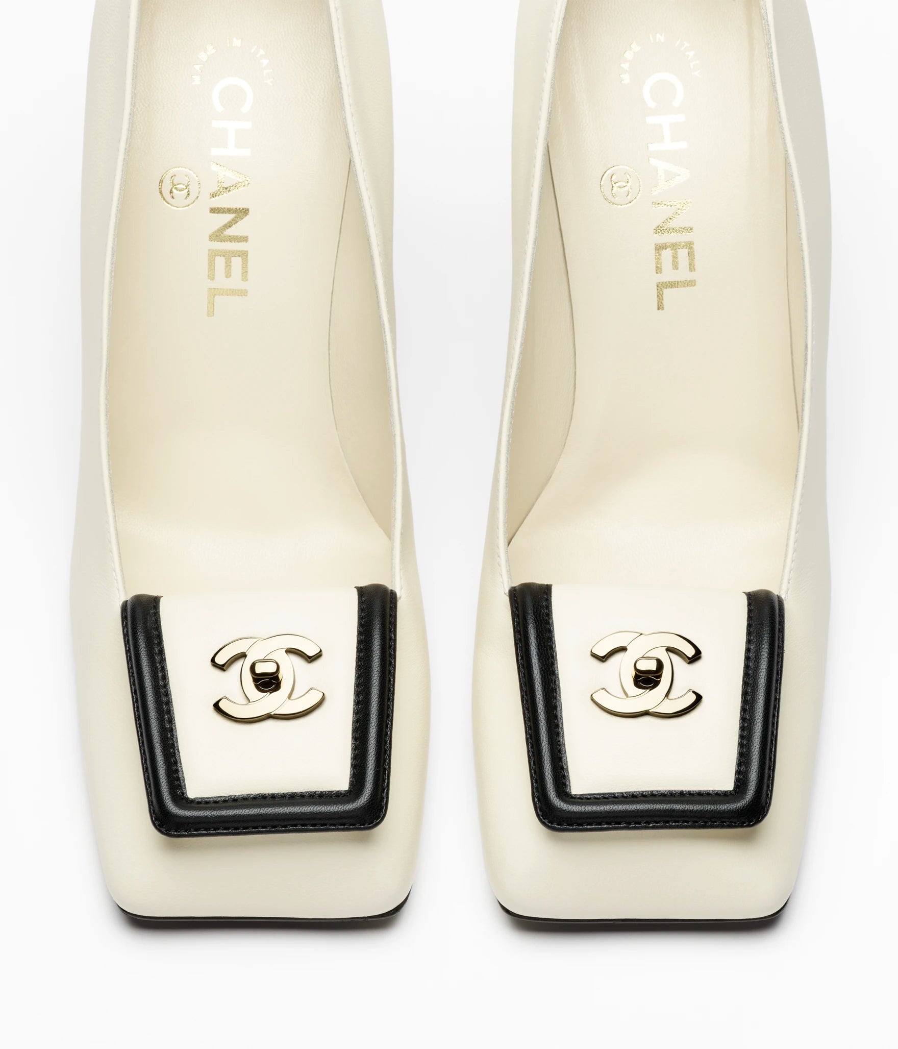 CHANEL Buckle Pumps

Color: White/Black